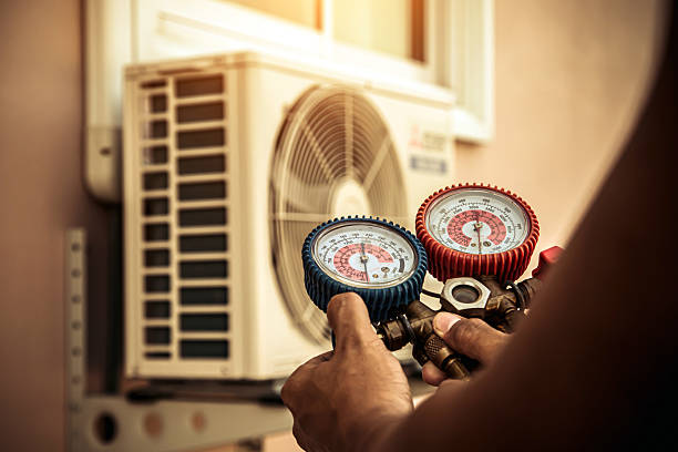 Professional Heat Pump Repair technician working in Pepperell, MA